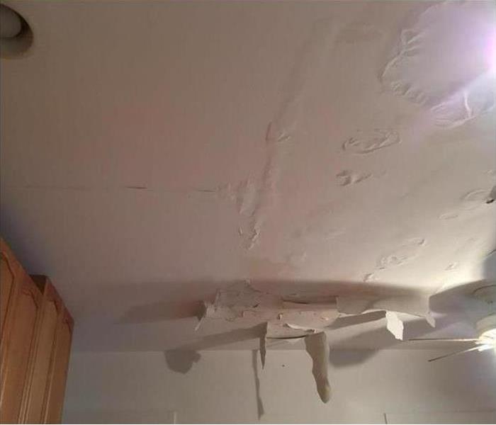 hanging ceiling material and water damage visible