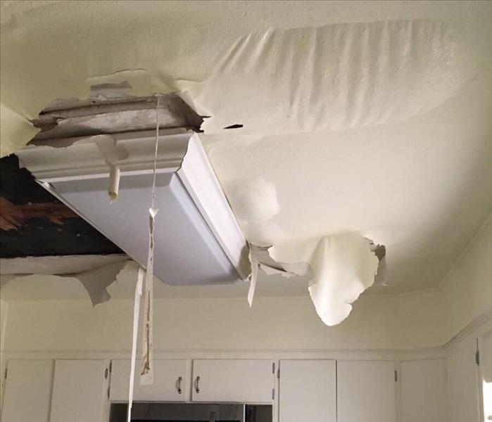 blistering ceiling paint, damaged panels from water